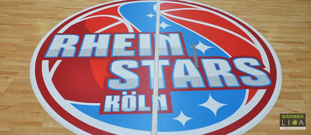 Basketballplatz-Logo der RheinStars Köln in Rot und Blau mit Sternen.